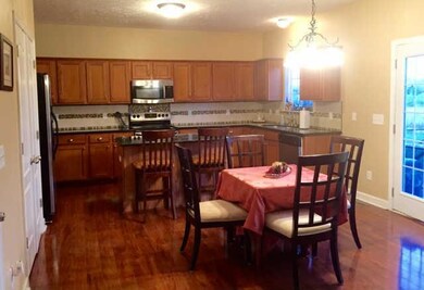 Kitchen is open to great room. Granite, tile backsplash,  s.s. appliances  large island, tons of storage.     