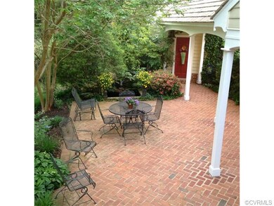 Brick patio with Koi pond.