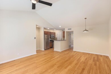 Unfurnished living room featuring visible vents, 