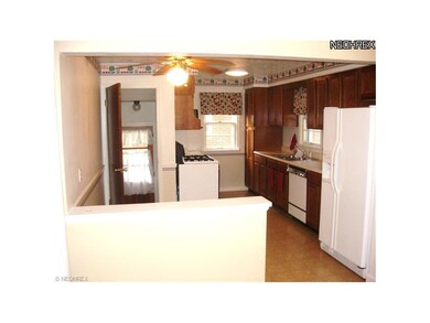 Dining room opens into cheery eat-in kitchen.