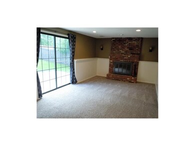Beautiful family room features brick fireplace