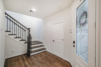 The freshly refinished front door with glass detai