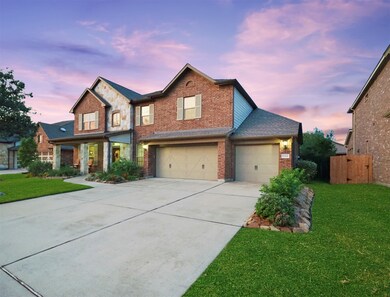 Lovely stone accents and professional landscaping provide stunning curb appeal.