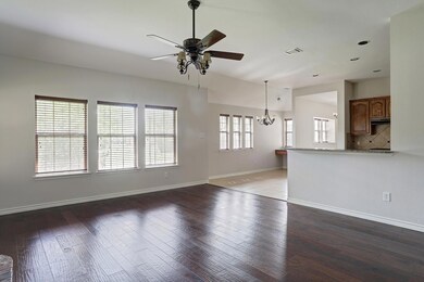 Unfurnished living room with ceiling fan with nota