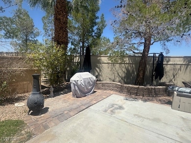 Fenced backyard with a patio