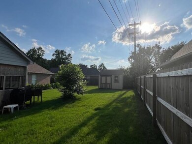 View of yard with a shed