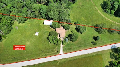 +-3.99 acres on paved road.