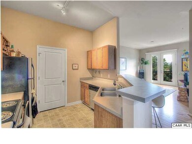 Cherry cabinets, stainless appliances with black a