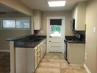 Kitchen has been updated with new cabinets, counte