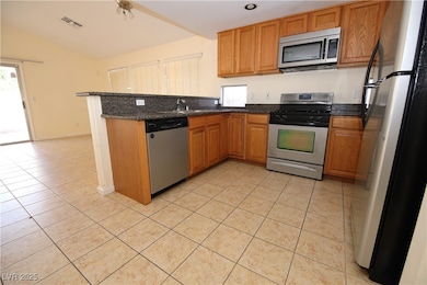 Kitchen featuring stainless steel appliances, ligh