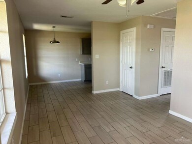 Unfurnished room featuring wood finish floors and a ceiling fan