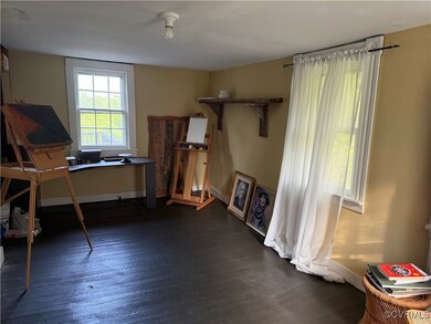 Office area featuring dark wood-style flooring