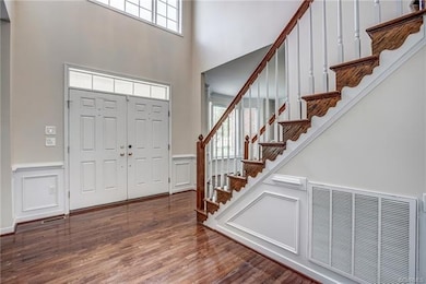 Two Story Foyer with Glass Transomes over Front Do