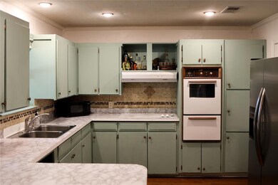 Kitchen with under cabinet range hood, white appli