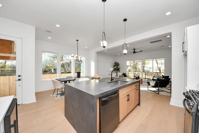 The large island adds warmth to the home, compleme