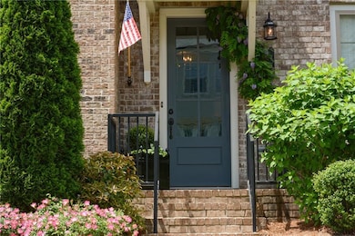 Doorway to property with brick siding