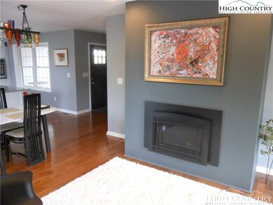 Living room looking back to front entry.