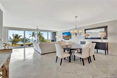 Seamless dining and living space with travertine f