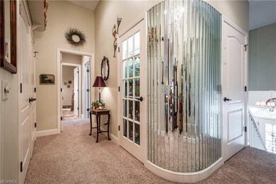 The entry hall features rounded walls, access to t