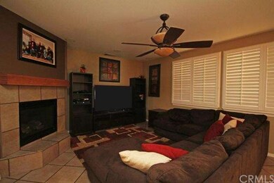 Cozy family room with shutters and upgraded ceilin