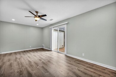 Empty room featuring ceiling fan, wood finished f