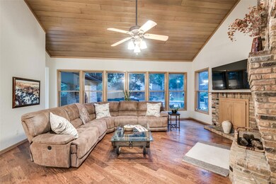 Wall of windows looks out to amazing back yard