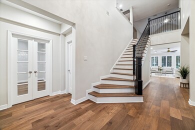 The foyer welcomes you with stunning wide plank Eu