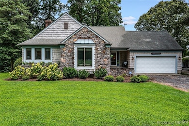 Craftsman-style house featuring a chimney, gravel