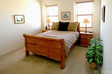 Large master bedroom with view of courtyard and wa
