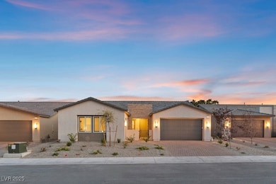 Single story home with a garage, stucco siding, an