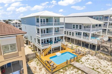 Rear view of property featuring a balcony and a pool side deck