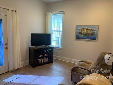 master bedroom being used as a tv room