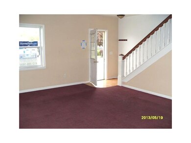 Living Room. From the covered front porch step int