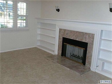 Living room fireplace Wide louvered shutters