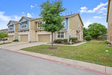 Townhome / multi-family property with stone sidin