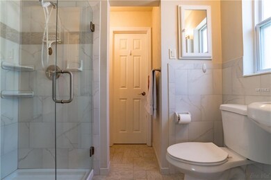Master bath has a separate vanity and cabinets.