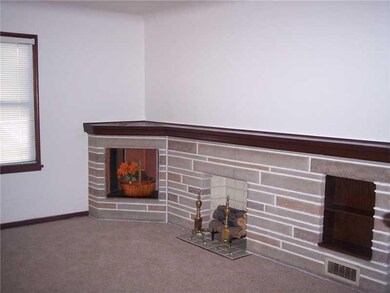 Living Room. Attractive, decorator fireplace along