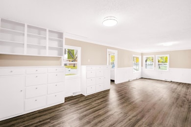 #3 - Living Room & Dining Room with Built Ins from Kitchen.jpg