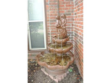 Fountain in front flower bed can stay.