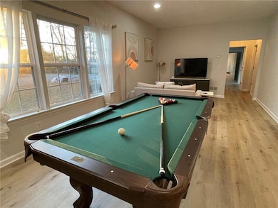 Rec room with baseboards, recessed lighting, billi