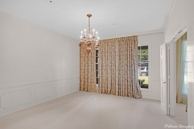 Formal dining room, pretty chandelier, wainscot wa