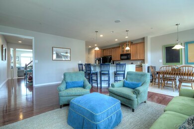 View of family room into kitchen with a better view of breakfast nook and glimpse into formal living room.