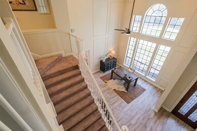 View from the Balcony upstairs shows just how much natural light and open floor plan away