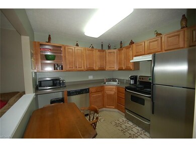 the kitchen offers loads of storage and a full sui