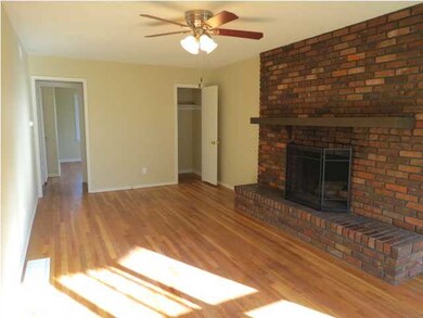 Living room with original hardwood floors and wood
