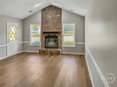 SPACIOUS GREAT ROOM WITH A COZY FIREPLACE