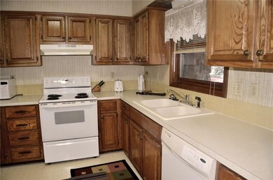 Kitchen has ample cabinet space for all your cooking needs.