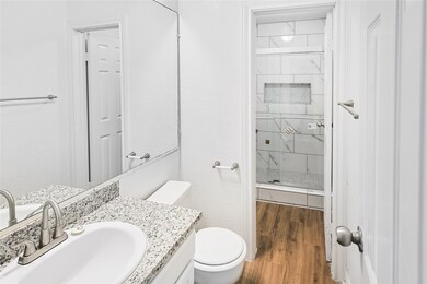 This full bathroom also offers a private shower ar