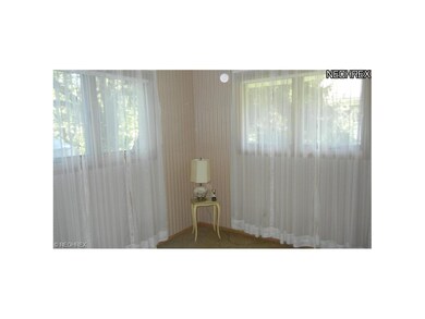 Back right bedroom with hardwood floors under the 