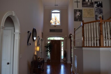 This home has a 2 story foyer that boasts exquisite molding, vaulted ceilings, and archways galore just to name a few